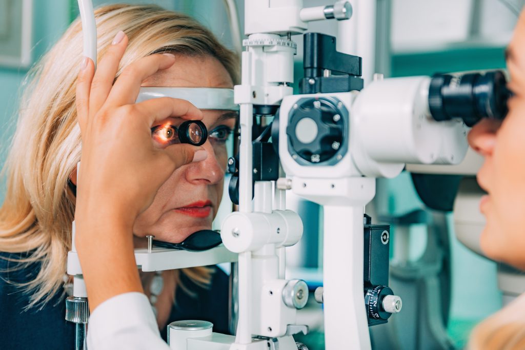 Woman having eye doctor check her eye health to represent Eye Exam in Schererville.